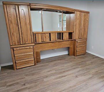 Finished room with restored built-in wood cabinetry and new flooring